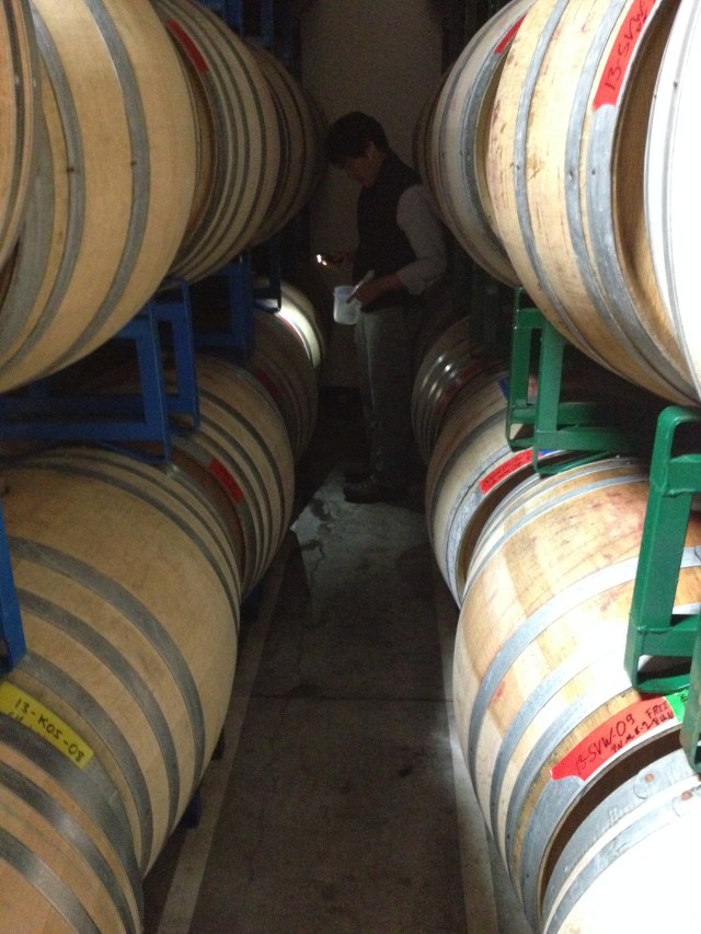 Byron, thief and flashlight in hand, among his barrels.