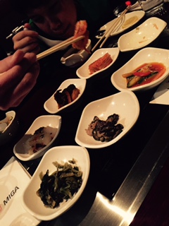 At Korean restaurants, you are served all these small dishes of various types of Kimchee, called "Banchan."
