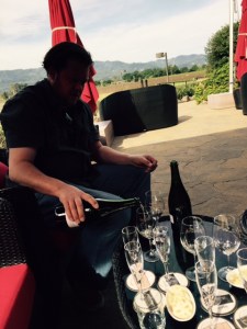 Our host pouring with the expansive Valley as a backdrop.