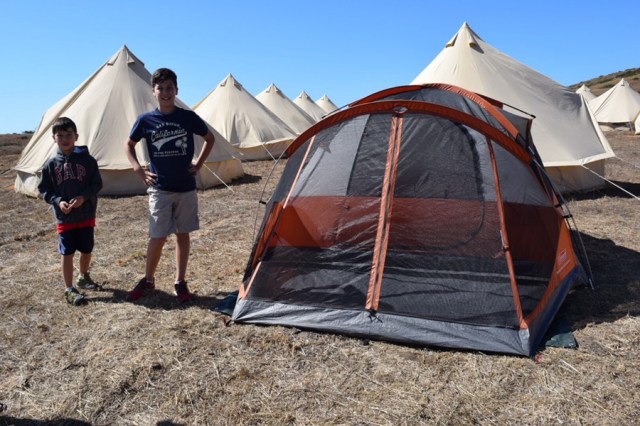 Our tent, which we put up in 50 miles an hour winds. You can see the fancy-pant tents in the background.