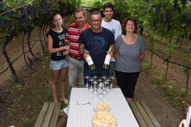 Our first tasting in the vineyards (under la pergola Tentino) with a grower family and Mezzacorona winemaker Lucio Matricardi (center). 